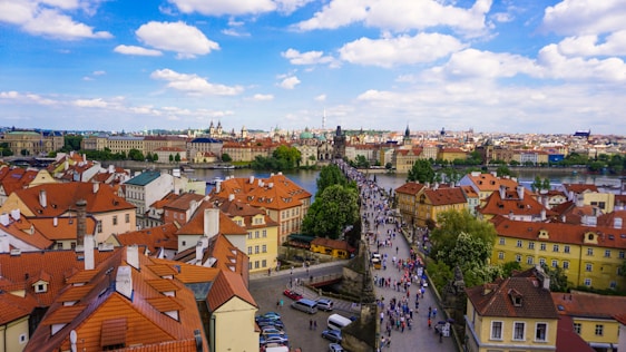 A serene view of a European landmark with travelers enjoying the scenery.