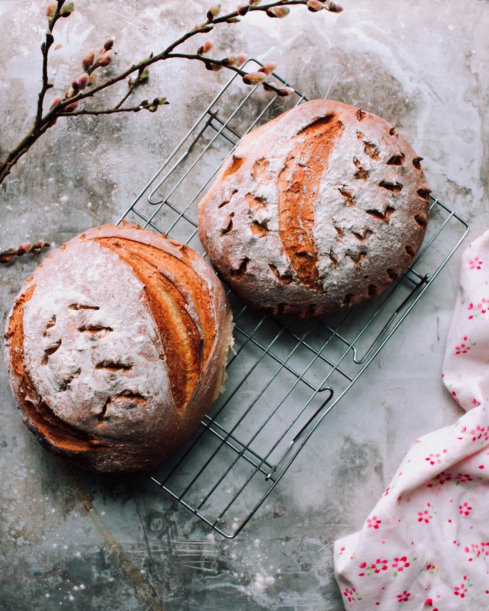 two round brown breads on metal grill