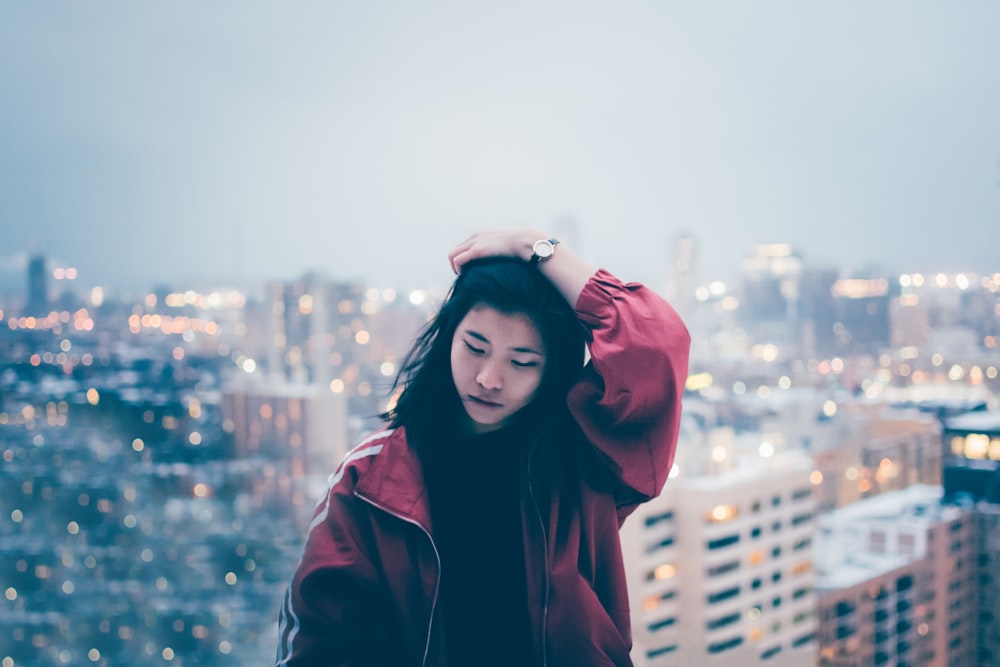 woman holding her hair