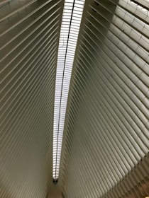 Abstract architectural lines converging upward, symbolizing structured growth and strategic alignment.