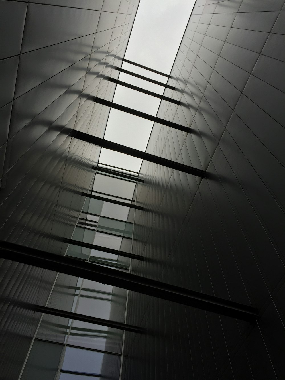 gray concrete building under white sky at daytime