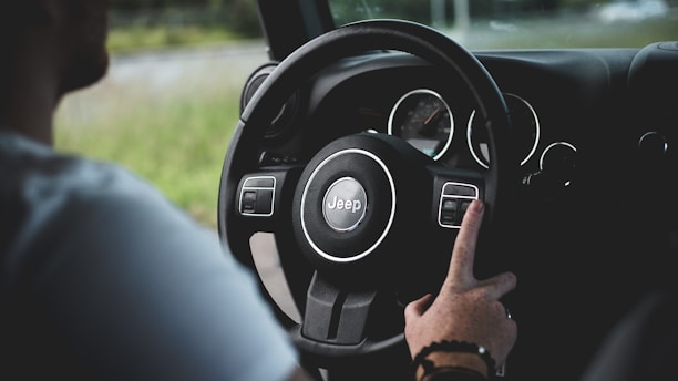 person driving Jeep car
