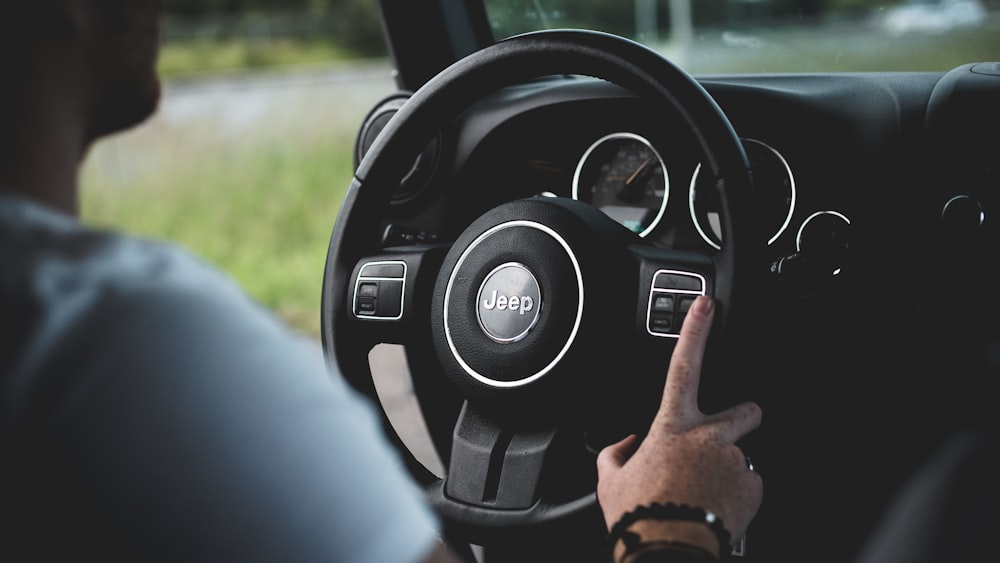 person driving Jeep car