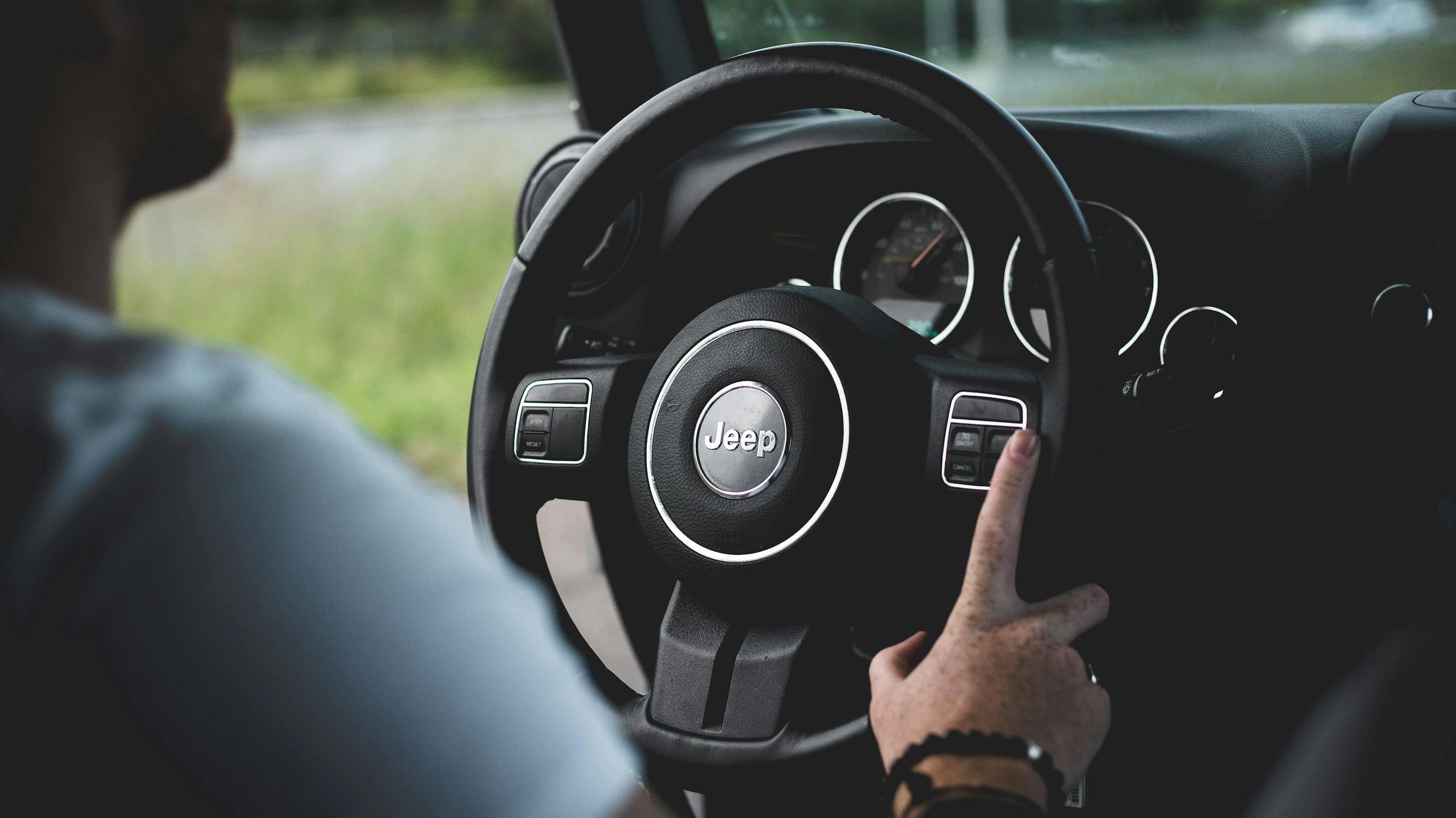person driving Jeep car