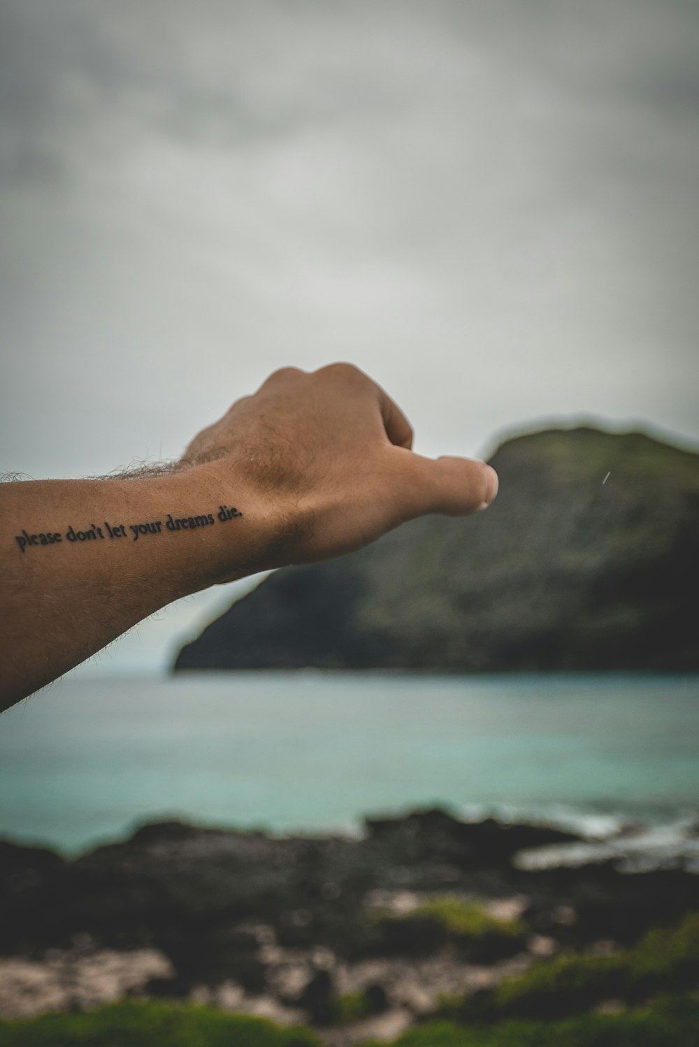 close-up photography of human's hand tattoo