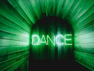 brown door with Dance neon lights