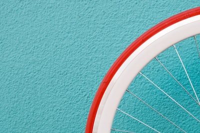 photo of red and white bike tire wheel zoom background