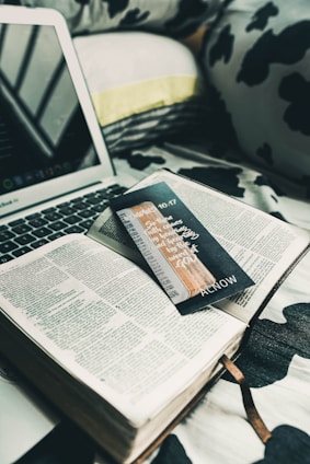 An open laptop displaying an ebook on a cozy desk.