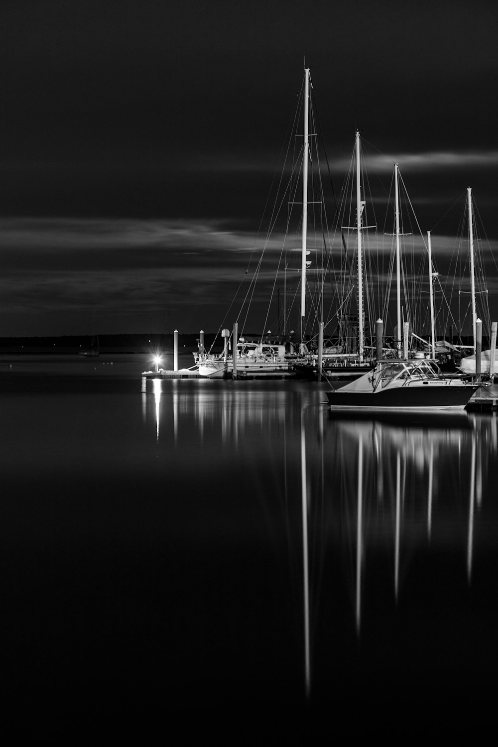 greyscale photo of boat on top of water