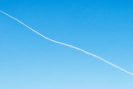 white smoke on blue sky