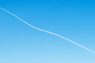 white smoke on blue sky