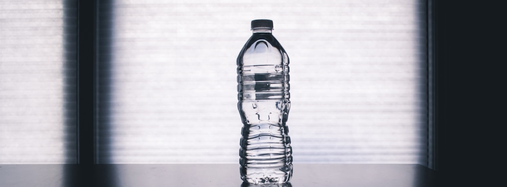 clear drinking bottle filled with water