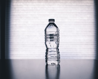 clear drinking bottle filled with water