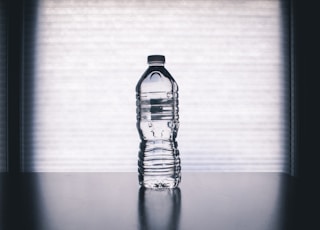 clear drinking bottle filled with water