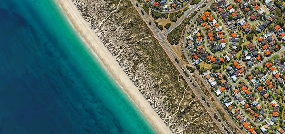 aerial photography of buildings beside calm water