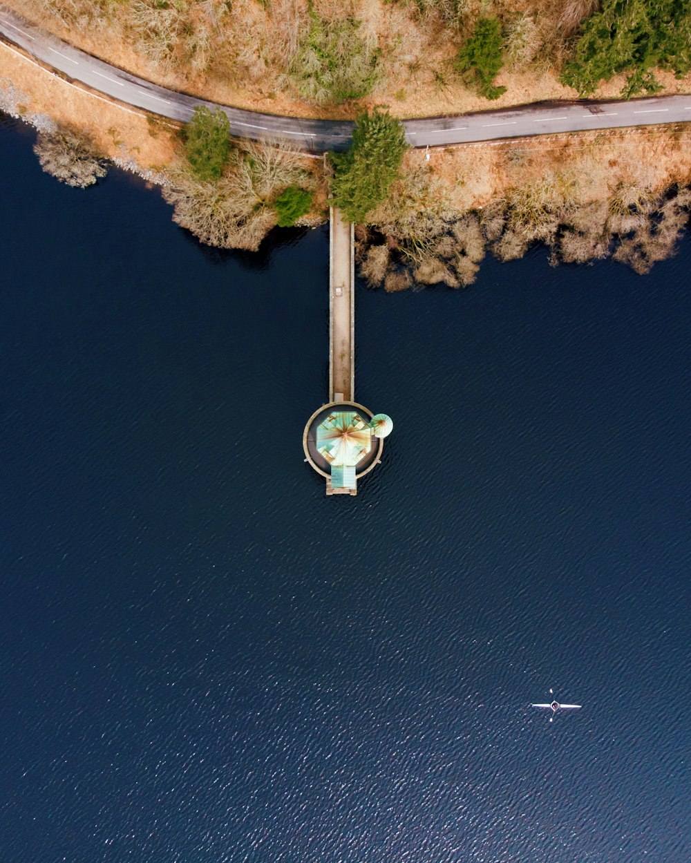 aerial view of dock on body of water beside island