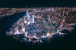 Aerial view of a vibrant city skyline at night.