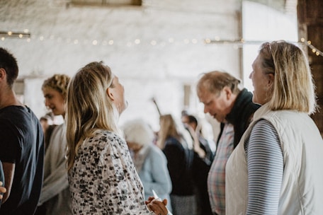 A group of people discussing and sharing ideas in a casual community setting.