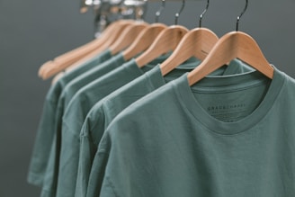 t-shirt design website showing photo of blue crew-neck tops