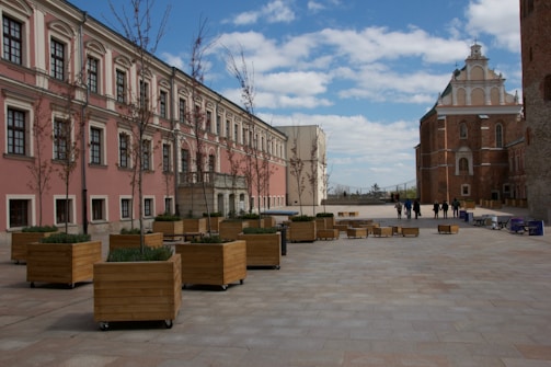 Wide shot of a paved outdoor courtyard with bricks.
