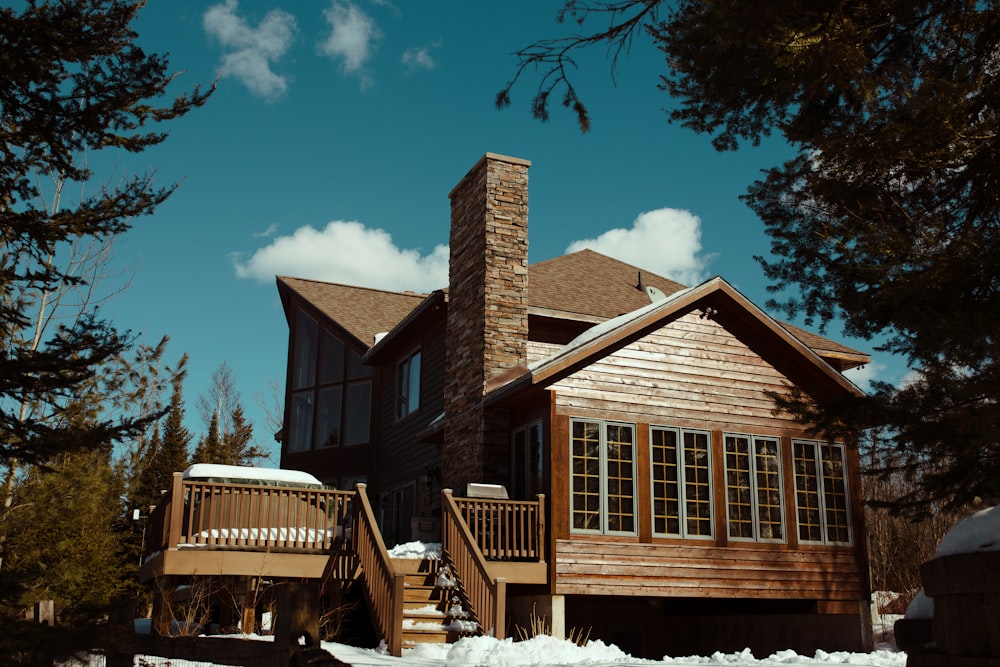 brown house surrounded by trees