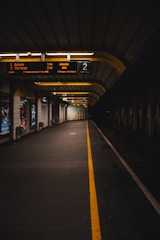Empty train station platform representing exploration and global travel planning