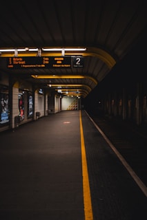 Empty train station platform representing exploration and global travel planning