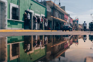 A vibrant city street scene featuring models wearing Street Colors apparel, showcasing the brand's urban style.