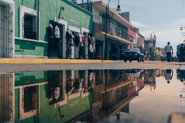 Concrete structure reflected on water during daytime — Puebla, Mexico