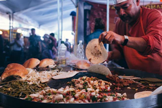 A lively showcooking event with guests watching the chef craft Oaxacan specialties.