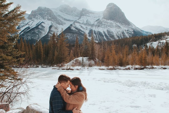 man and woman embracing each other in Ha Ling Peak Canada