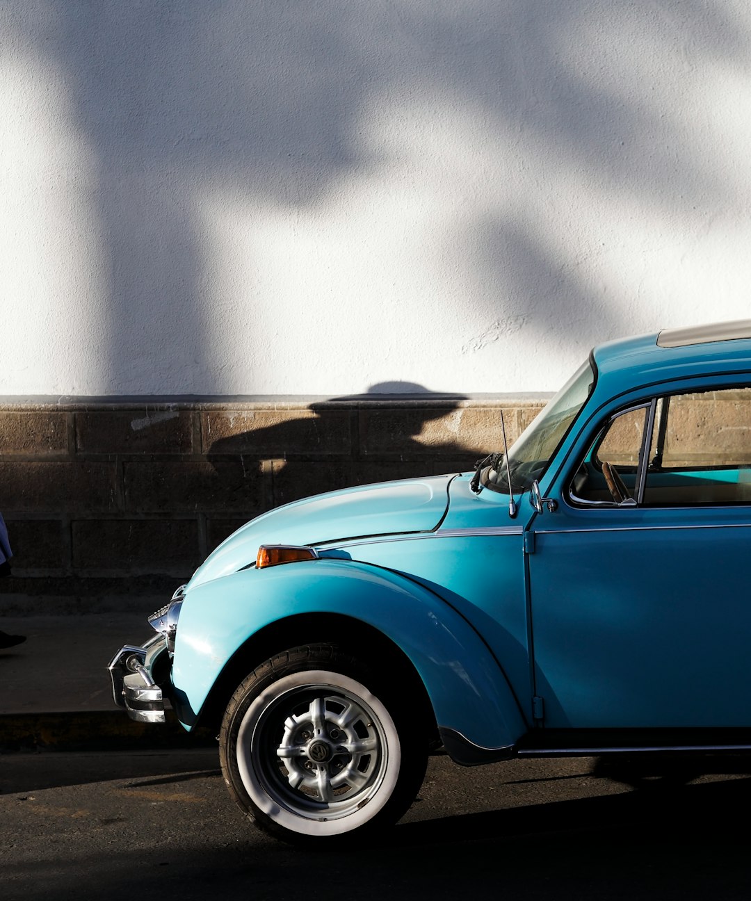 blue car on road