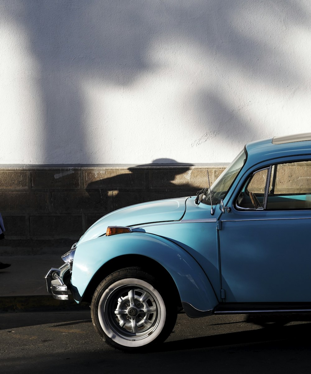 blue car on road