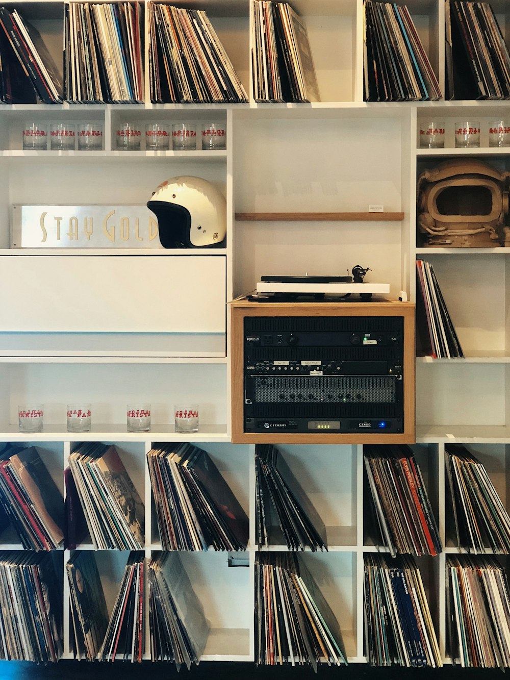 vinyl sleeves on white wooden cube shelf