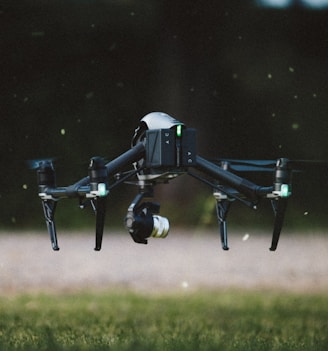 selective focus photography of black and gray quadcopter drone taking flight