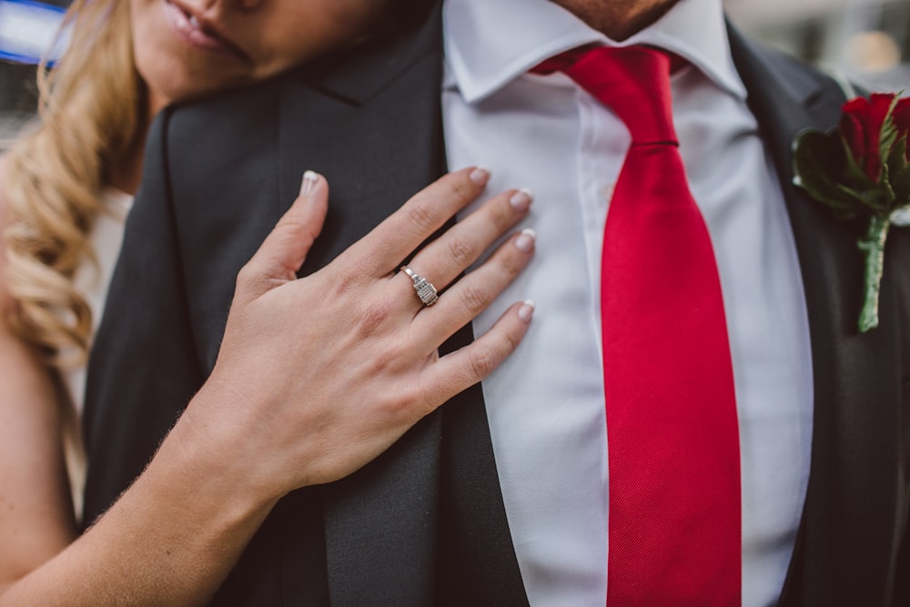 woman hugging man in suit jacket