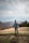 man walking on mountain carrying bag