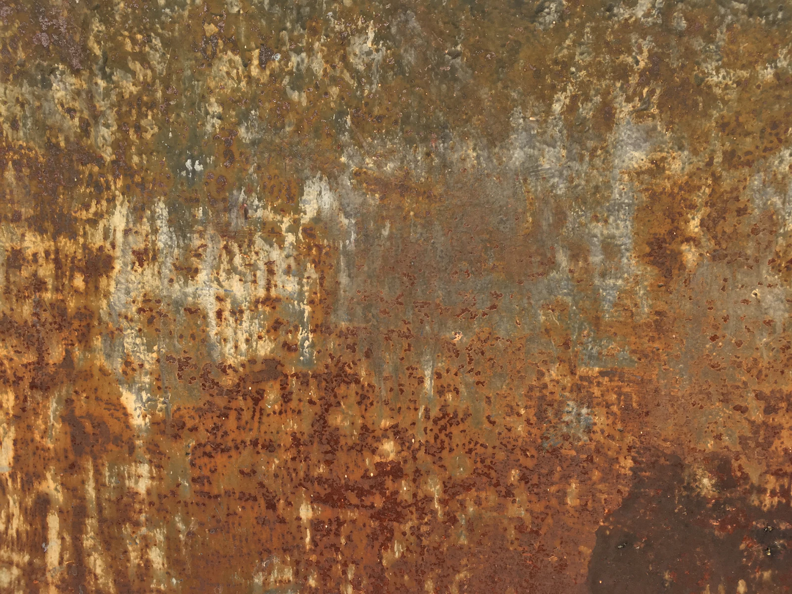 A heavily rusted metal surface, the kind of corrosion salt air speeds up
