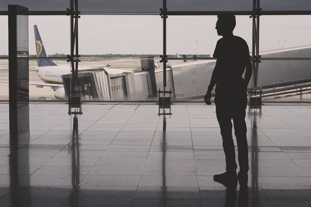 silhouette of man on airport lounge, Guy on an airport