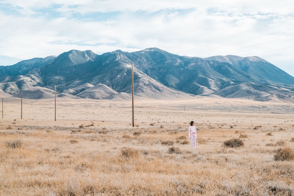 woman standing on grass field