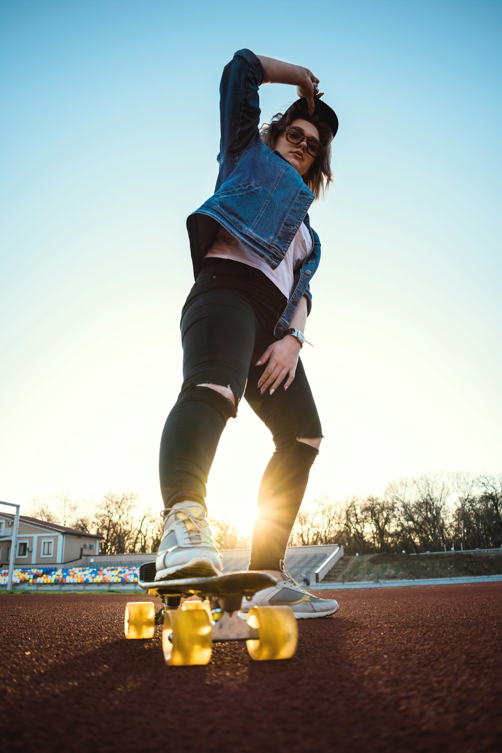 woman stepping on cruiser board