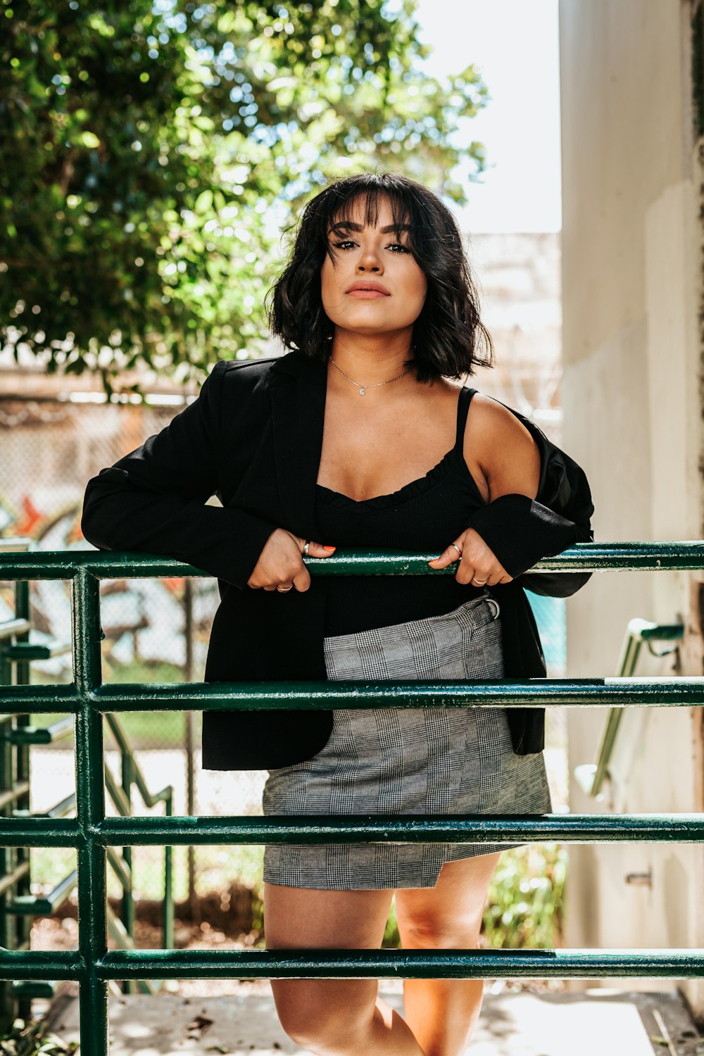 woman leaning on fence