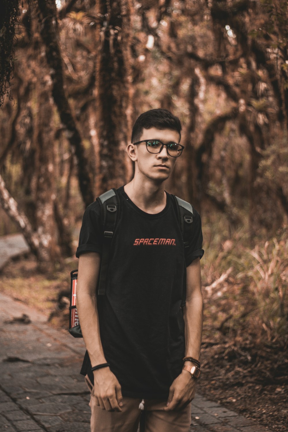 man wearing black spaceman shirt