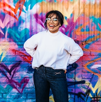 woman standing in front of multicolored wall