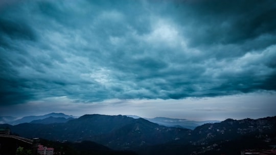 mountains under gray clouds in Shimla India