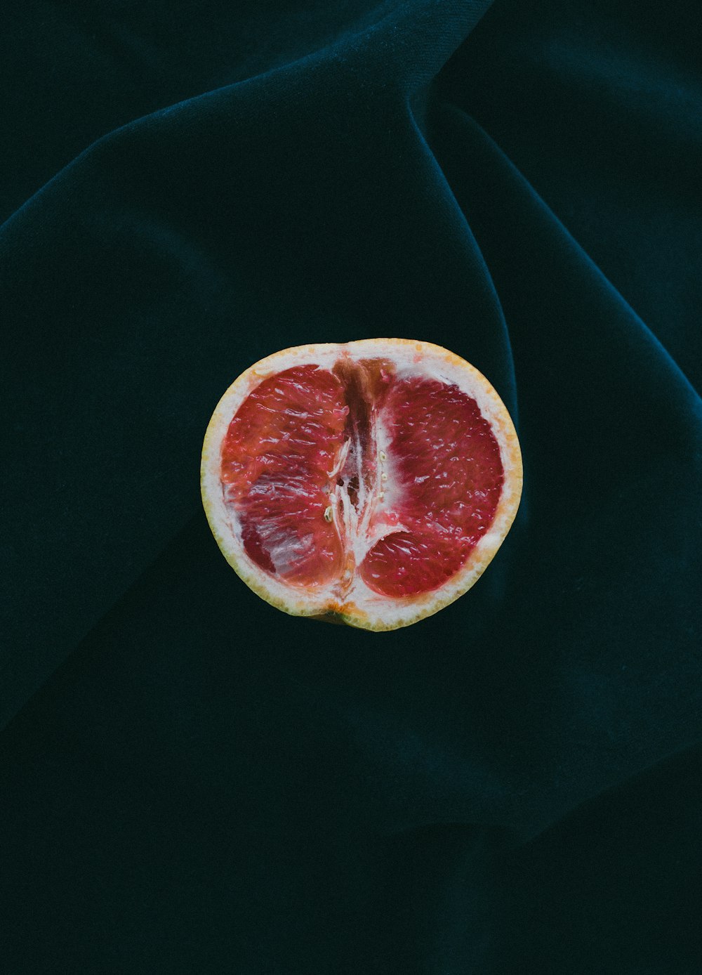 grapefruit on black surface