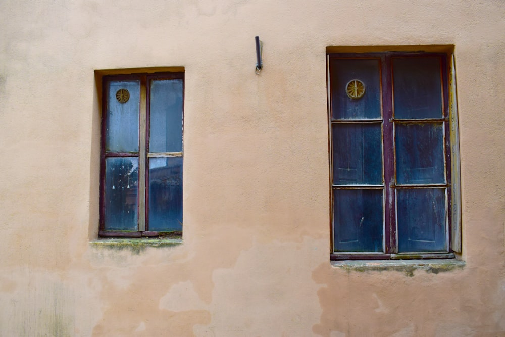 closed brown wooden framed glass window