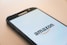 black Samsung Galaxy smartphone displaying Amazon logo