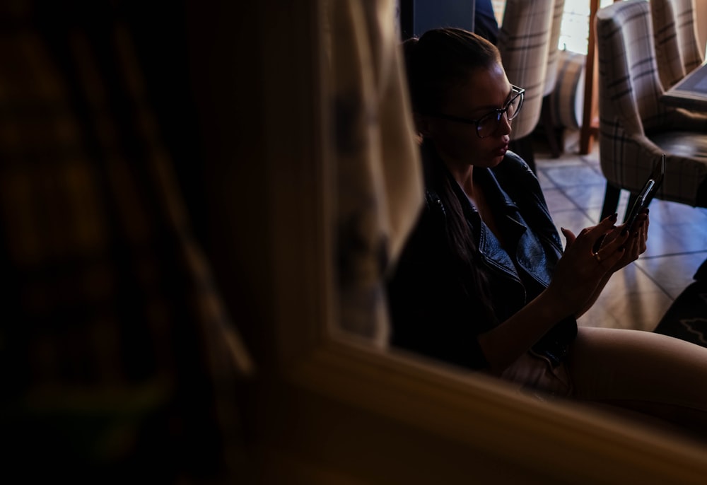 woman holding smartphone