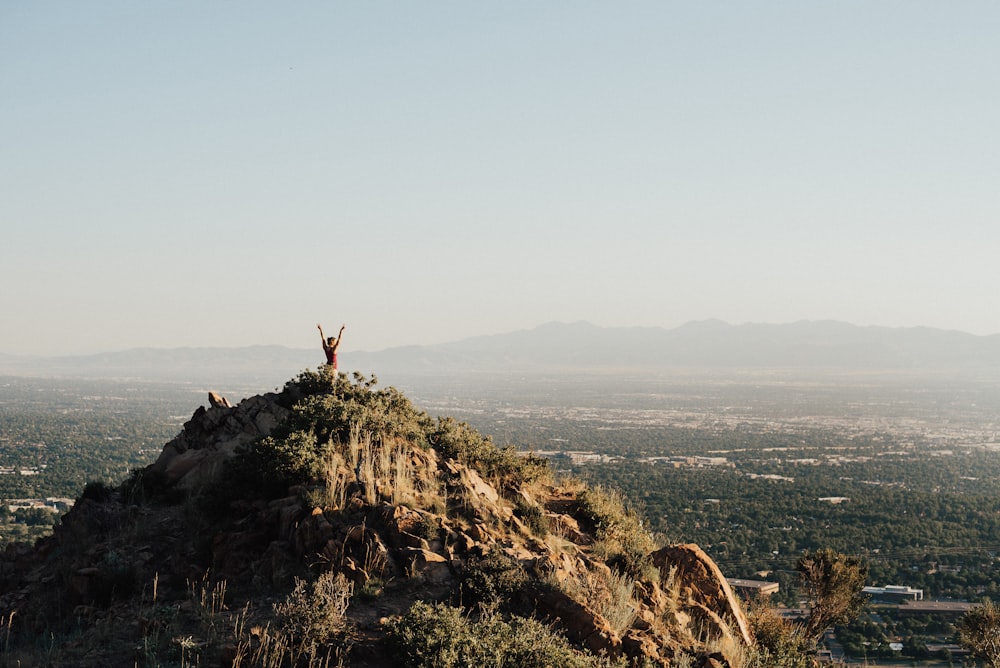 person on top mountain